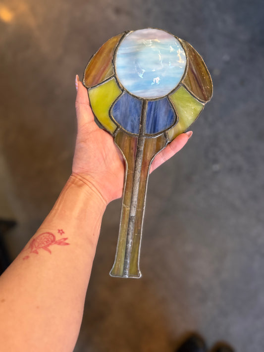 Vintage stained glass hand mirror in the shape of a moth
